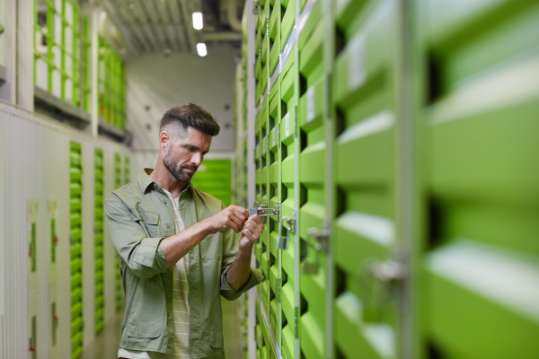 Person locking a self-storage unit